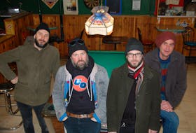 Members of The Love Junkies, from left, Pat Deighan, Dennis Ellsworth, Chris Coupland and Dan Wagner pose for a photo at their favourite drinking establishment, the Sportsman's Club in Charlottetown.  Missing from photo is Colin Buchanan. The band will be performing during The Guardian's Frosty Night - a free evening of entertainment on Victoria Row in Charlottetown, Feb. 17, that will end with a fireworks display. GUARDIAN PHOTO