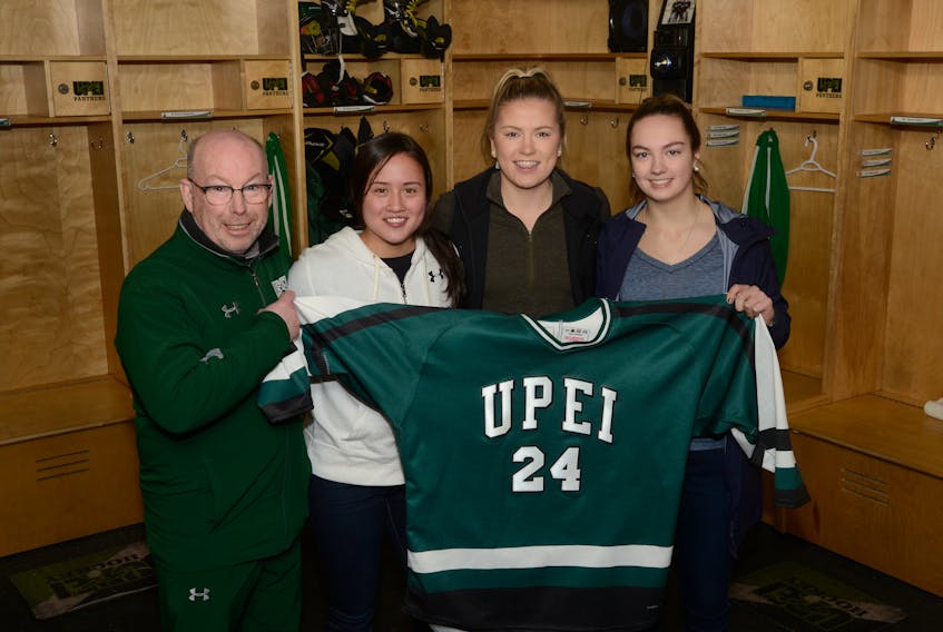 The UPEI Panthers have landed a trio of Islanders for the 2018-19 season. From left are head coach Bruce Donaldson, Parker McCabe, Kelly Clements and Taylor Gillis.