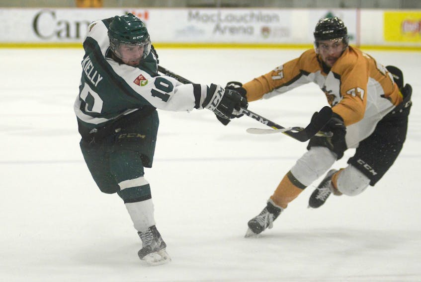 UPEI Panthers forward Kameron Kielly takes a shot as Dalhousie Tigers defenceman Colton Heffley tries to deflect it Friday during Atlantic Unviersity Sport hockey action at MacLauchlan Arena.