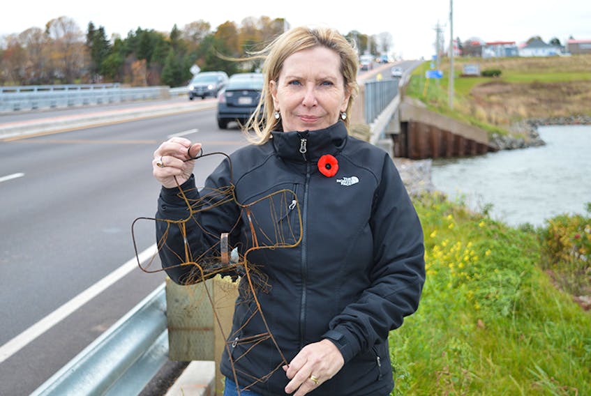Dianne Young was heartbroken to see that someone had burned the flower arrangement she put on the North River bridge in memory of her son who took his own life in 2013. She put up a new flower arrangement on Wednesday. ©THE GUARDIAN/Dave Stewart