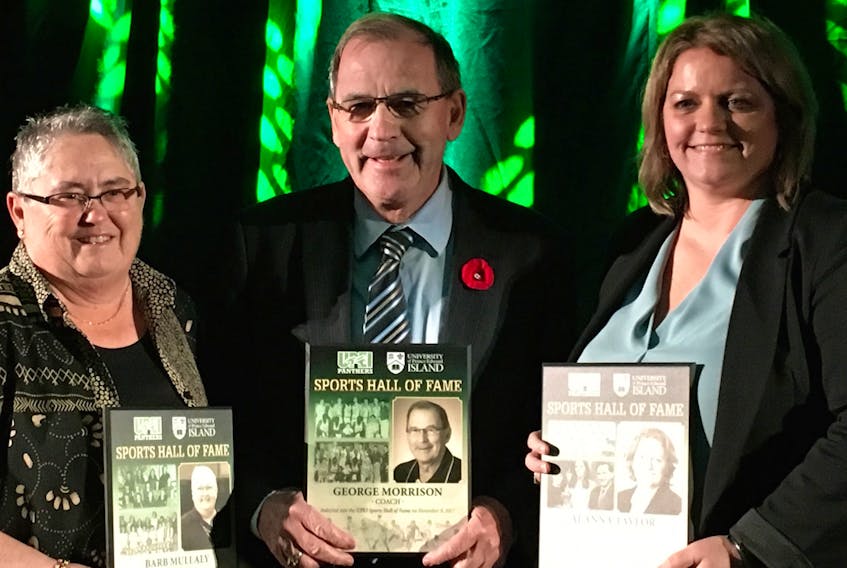 Mary Lou Turner, left, representing inductee Barb Mullaly, George Morrison and Alanna Taylor hold their plaques after being inducted into the UPEI Sports Hall of Fame on Thursday in Charlottetown. Charles Reid/The Guardian