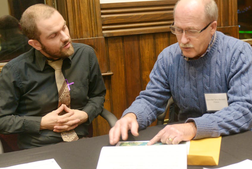 Charlottetown resident Josh Underhay, left, chats with Coun. Terry Bernard during a pre-budget open house held at City Hall on Wednesday night. The open house gave residents a chance to ask questions and make suggestions on improvements the city can make with its 2018 operational budget.