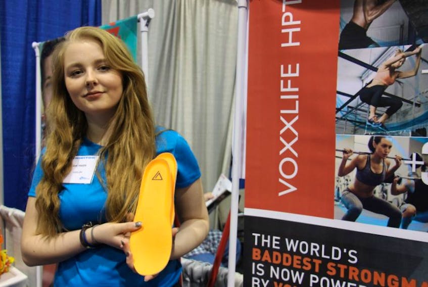 Sam Johnson, promotes socks and footwear designed to help with muscle related injuries and diseases. She is working with her mother Shelley Fraser, a sales associate for VoxxLife. Their booth was at the 2017 Provincial Home Show in Charlottetown.
