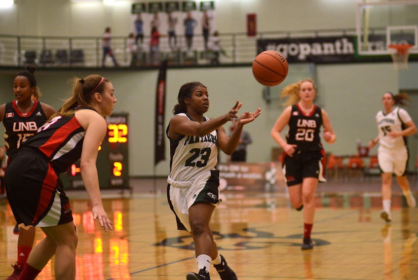 UPEI Panthers guard Kimeshia Henry passes to a teammate during a fast break play Friday against the UNB Varsity Reds. Jason Malloy/The Guardian