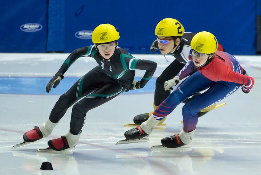 Alex Rogers, left, of Charlottetown takes a corner at a speedskating event in Saint John, N.B. Rogers won a bronze medal for P.E.I. at the recent Atlantic Canadian short track championships in Dieppe, N.B.  
Photo special to The Guardian by Amanda Burke.