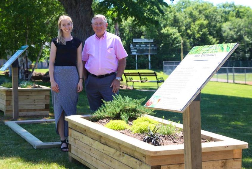 Jessica Brown, the City of Charlottetown’s sustainability outreach co-ordinator, and Deputy Mayor Mike Duffy, chairman of the environment and sustainability committee, check out the demo beds at Victoria Park.