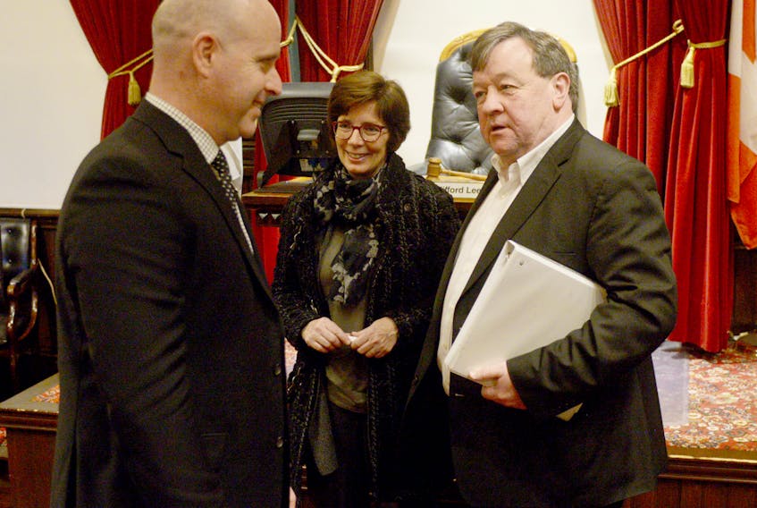 Charlottetown Mayor Clifford Lee, from right, chats with the city solicitor Karen Campbell and Coun. Greg Rivard following Monday’s council meeting. Lee said he feels the council’s decision to start the city’s overnight parking ban two hours earlier, an amendment which passed its first and second reading on Monday, is one councillors will ultimately regret.