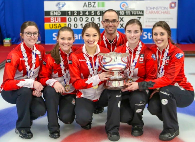 The Canadian women’s team at the world junior curling championships in Aberdeen, Scotland, displays its trophy and gold medals after winning the world title. Left to right is alternate and New Dominion native Lauren Lenentine, lead Lindsay Burgess, second Karlee Burgess, coach Andrew Atherton, third Kristen Clarke and skip Kaitlyn Jones from the Halifax, N.S.-based rink.