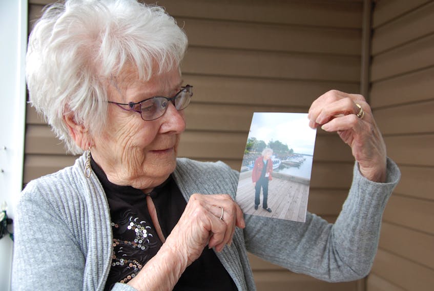 Della Kielly, 92, of Charlottetown holds a photo of her sister Jean Soper when the sibling made her last visit to P.E.I. about five years ago. Kielly is going to visit her beloved sibling, who has Alzheimer's disease, in a nursing home in Rhode Island.