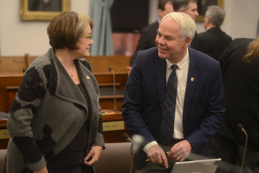 Green Party Leader Peter Bevan-Baker, right, chats with Green MLA Hannah Bell before question period. Polls are suggesting Island voters could soon elect Canada's first Green government.