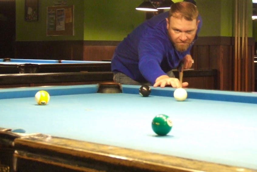Charlottetown’s Ryan Grant line up a shot in a recent practice round. Grant with represent P.E.I. in the 8-ball, 9-ball and 10-ball event at the Canadian Billiards and Snooker Association (CBSA) open nationals May 22-27 in Toronto.