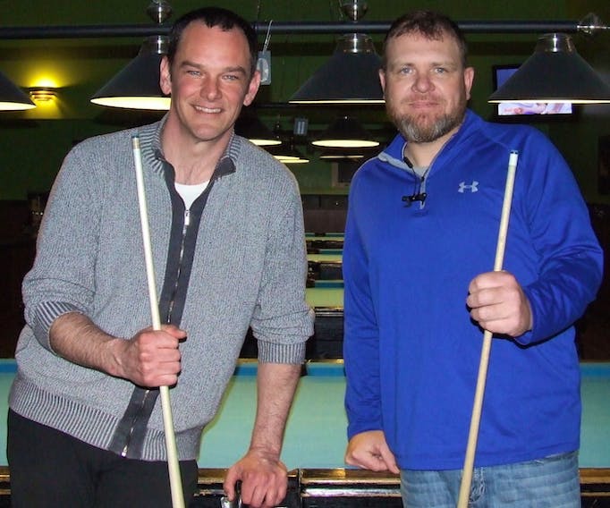 Andrew Sprague, left, and Ryan Grant take break from shooting pool in a recent practice round. Sprague and Grant are part of the 11-member board of directors aiming at starting a new provincial billiards association later this to administer the sport.