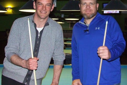 Andrew Sprague, left, and Ryan Grant take break from shooting pool in a recent practice round. Sprague and Grant are part of the 11-member board of directors aiming at starting a new provincial billiards association later this to administer the sport.