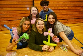 Colonel Gray leadership class members, from left, Sophia Bell, Isabella White, Sarah White, Juma Farag and Bila Gaite display some balloon animals during the kids carnival fundraiser held recently at the school. The event, which featured toys, games and more, was organized by the class and raised funds for St. Jean Elementary School’s lunch program.