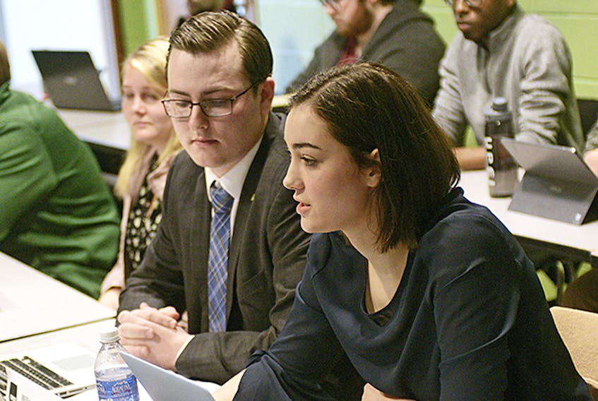 UPEI Student Union VP of Academic and External, Taya Nabuurs, speaks during a special meeting held at the university on Sunday to detail an ombudsperson’s report on allegations made against former president Chelsea Perry. Next to Nabuurs is interim president and VP of Finance and Administration, Will McGuigan.  ©THE GUARDIAN