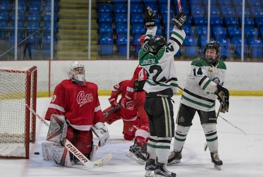 Luke Garnhum, centre, of the Charlottetown Pride celebrates with teammate Kennedy Gallant after completing his hat trick against Fredericton Office Interiors Caps goaltender Frederic Plourde in N.B./P.E.I. Major Midget Hockey League action Sunday at Willie O'Ree Place. The Pride won 5-3. Ellen Tramley-Seymour Photography