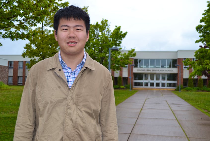 Valedictorian Chris Xu stands in front of Colonel Gray High School in Charlottetown. The 17-year-old is the son of Patty Zhong and Peter Xu of Charlottetown. Chris, who enjoys sports and classical music, also plays percussion in the Colonel Gray High School concert band.