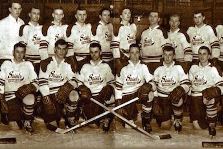 The Saint Dunstan's University Saints, who won the Maritime intercollegiate hockey championship in 1964-65, will be inducted into the P.E.I. Sports Hall of Fame next week. Front row, from left, are Mike Harley, Rex McCarville, Derrel Pollock, Gordie Whitlock, Vince Mulligan, Mike Kelly, Andre Gelinas and George MacNeill. Second row, coach Jack Kane, trainer Dave O'Connell, Jack Hynes, Maurice Roy, George Monaghan, Yvon St. Arnaud, Glen Hughes, Arthur LeClair, Denis DeCarufel, George MacMillan, Billy MacMillan and manager Jim Levy. Submitted photo
