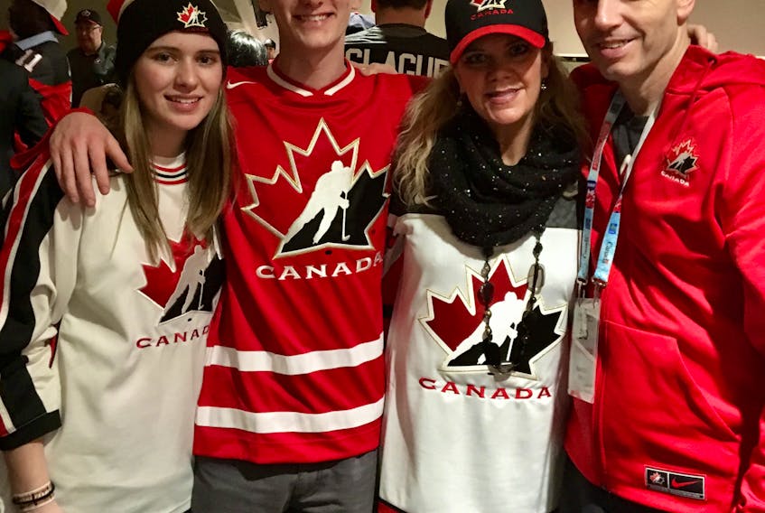 Kevin Elliott cherishes this picture taken with his family during last year’s world junior hockey championship in Toronto. From right are Elliott, wife Carolyn MacGuigan Elliott, son Mathieson Barr and Barr’s longtime girlfriend, Hannah Morrison.