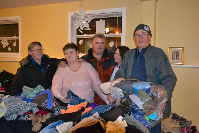 John Brown, Betty Begg, James MacKay, Ellie Trainor and Rob Brooks volunteer at the Gifts from the Heart event on Jan. 19 at the Hillsborough Community Centre, serving soup, clothes and goods to those in need.