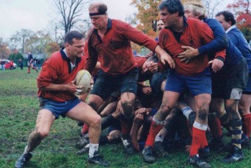 Mike Lloyd, holding ball, is pictured in senior men’s rugby action on the pitch. Lloyd is going into the P.E.I. Rugby Union Hall of Fame for re-energizing men’s rugby on P.E.I. and setting the foundation for high school rugby on the Island.
