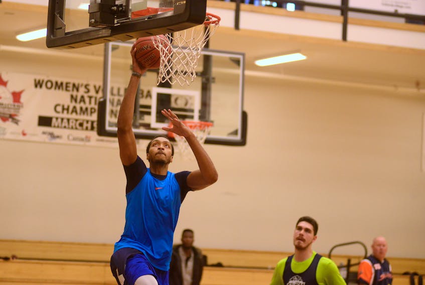 Asauhn Dixon-Tatum goes in for a dunk during an Island Storm practice as the team prepared for its first game of the National Basketball League of Canada season. Jason Malloy/The Guardian