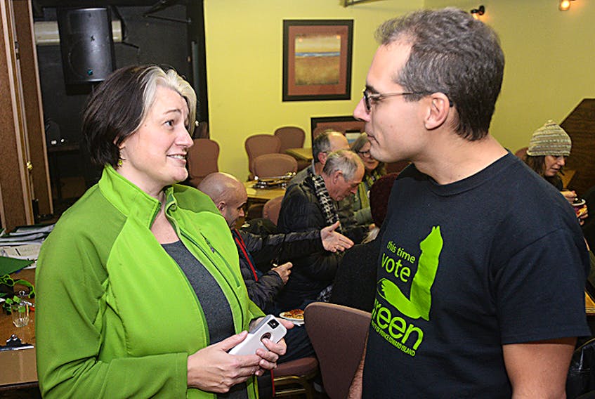 Green party candidate Hannah Bell chats with supporter Jordan Bober, with other campaign volunteers behind them, after a day of knocking on doors for the District 11 byelection. Bell said she hopes to bring a long-term vision to P.E.I.’s legislature.  ©THE GUARDIAN
