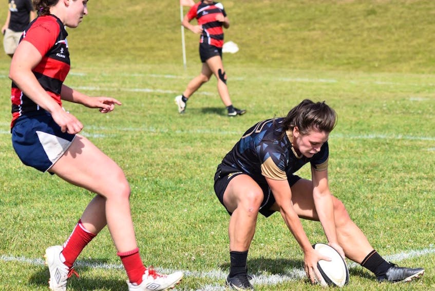 Alysha Corrigan, right, of the Charlottetown Rugby Football Club is pictured in action with the club versus the Truro Saints in Nova Scotia senior women’s rugby league action last summer.