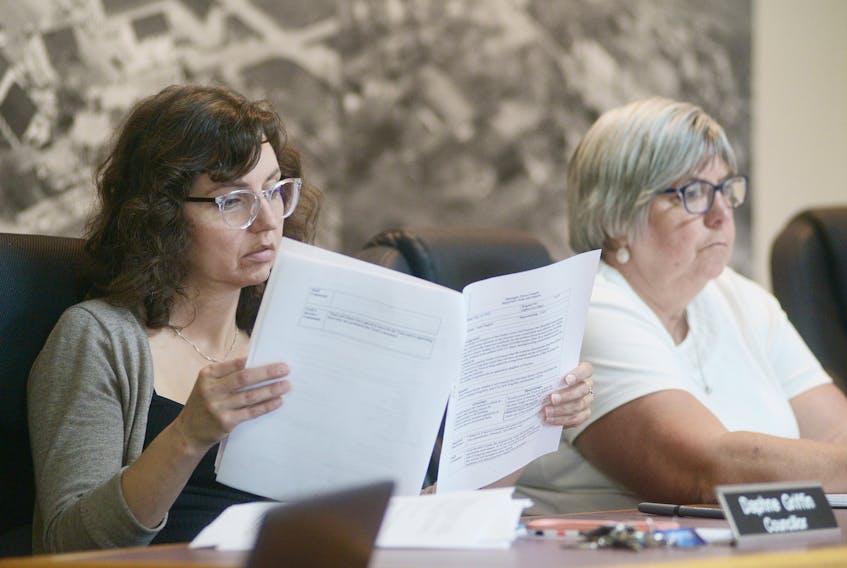 Coun. Daphne Griffin, left, looks over some files next to Coun. Debbie Johnston during Montague’s monthly council meeting Monday night. Griffin questioned whether council should make a long-term commitment to the Garden of the Gulf Museum with an upcoming election, while Johnston felt there needs to be a discussion on ways to draw more visitors to the museum.