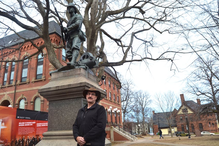 John Nicholson, shown in front of the Boer War Monument in Charlottetown, is the author of “Reading Between the Pictures: South Africa 1902”. The monument is dedicated to the men of the Royal Canadian Regiment who served during the South African campaigns. The names of two members of the Regiment from P.E.I. are inscribed on a separate marker.
