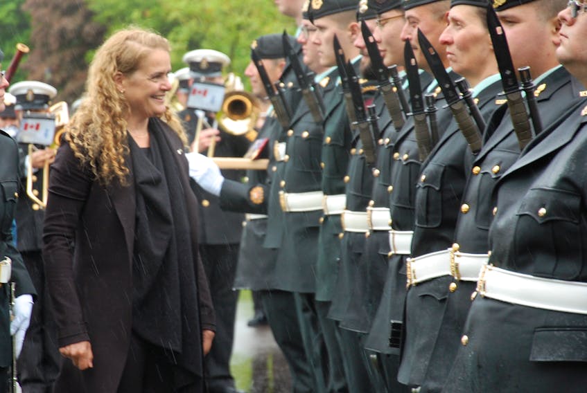 Gov. Gen. Julie Payette smiles as she inspects the guard of honour at Government House while receiving a 21-gun salute during her first official visit to P.E.I. as governor general.