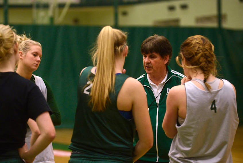 Head coach Greg Gould speaks with his UPEI Panthers women's basketball team after Thursday's practice.
