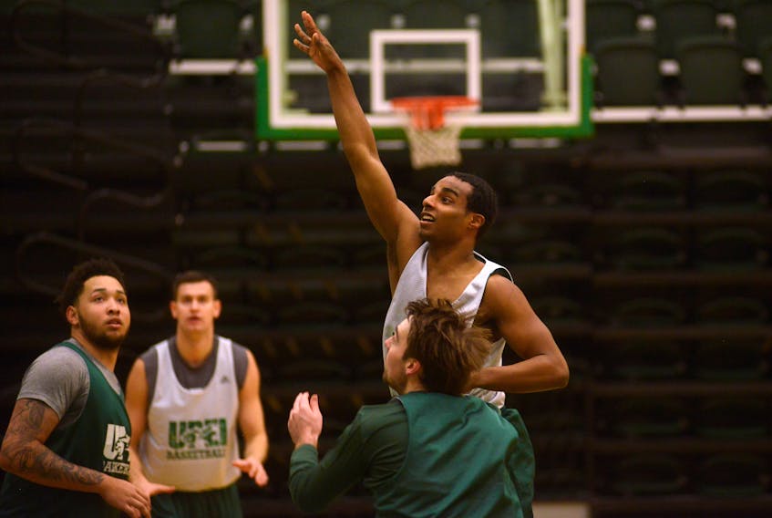 UPEI Panthers veteran guard Samy Mohamed takes a shot over teammate Logan MacDonald during Thursday’s practice.