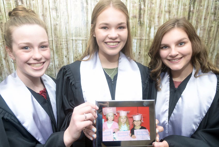 École La-Belle-Cloche graduates, from left, Emma Sweeney, Emma Dixon and Shea MacNeill.