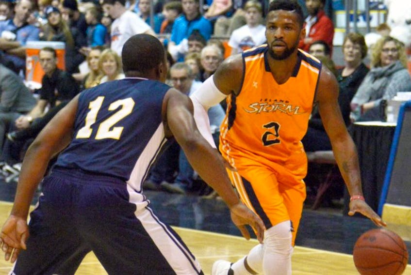 Island Storm guard Nick Okorie hustles past the Saint John Riptide’s Anthony Anderson during a National Basketball League of Canada game between the two teams on Boxing Day at Charlottetown’s Eastlink Arena. The Storm won 103-95.