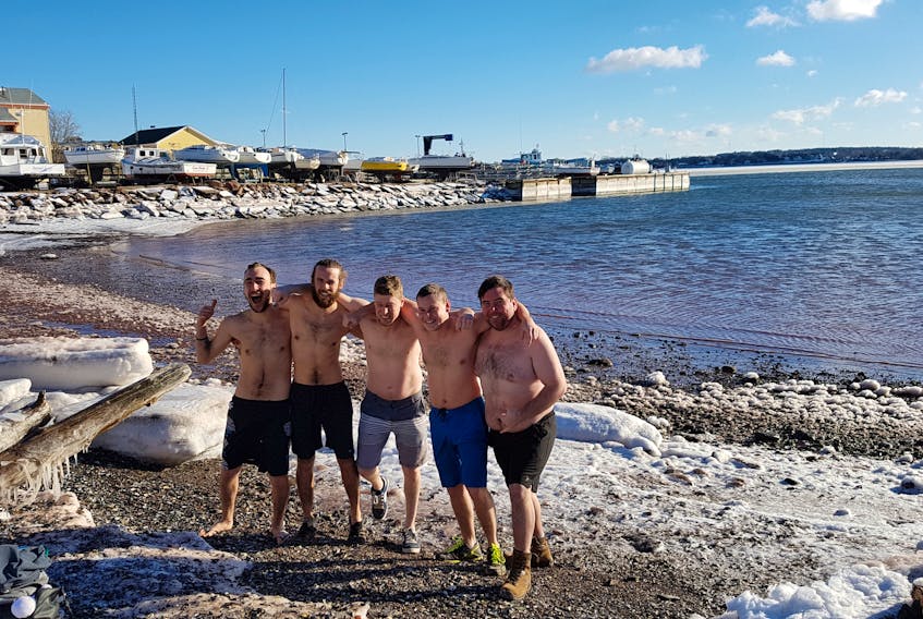 The cold weather isn’t enough to stop some people from taking a dip. John Stokes, left, Nathan Trainor, Scott Callaghan, Brett Beaton and Alan Trainor took the plunge at the Charlottetown Harbour on Dec. 26.