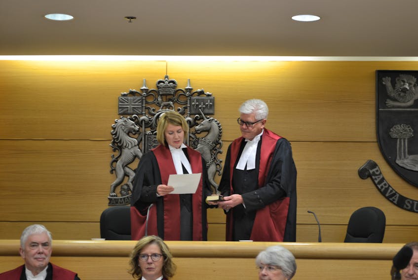 Tracey Clements swears her oath to then acting Chief Justice Gordon Campbell as part of her investiture as a justice of the Supreme Court of Prince Edward Island in this file photo.