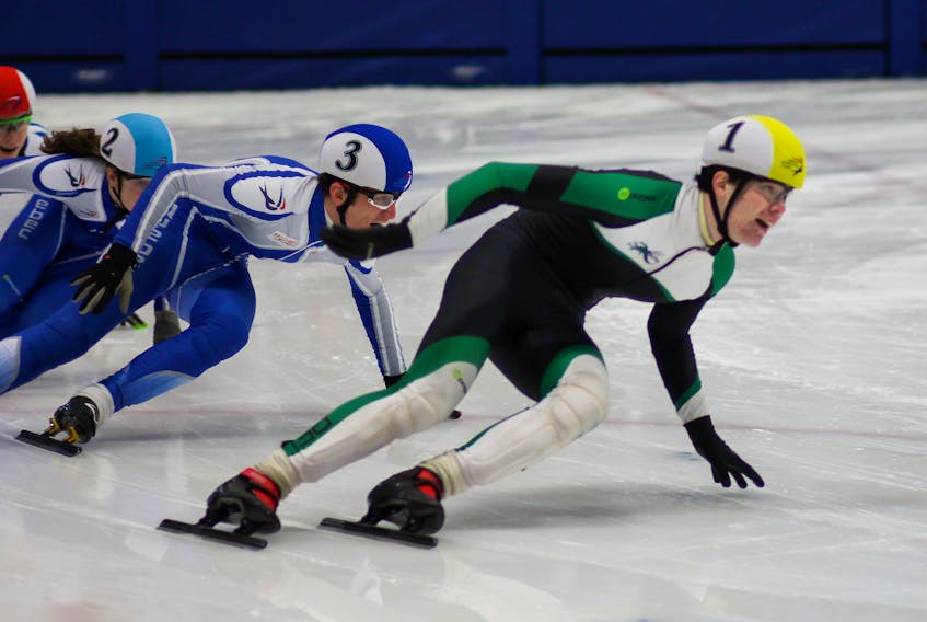 Andrew Binns, right, of Stratford set a new P.E.I. record for junior men at a recent short track speedskating meet in Chicoutimi, Que.  
Photo special to The Guardian by Kristen Binns.