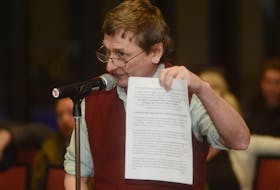 Carl Phillis, a casual worker for the City of Charlottetown, holds up a copy of a letter he’s sent to Prime Minister Justin Trudeau on P.E.I.’s employment insurance issues during a public forum at the Delta Prince Edward Tuesday. Phillis said P.E.I.’s dual zone and other changes to EI have had a devastating effect on workers.