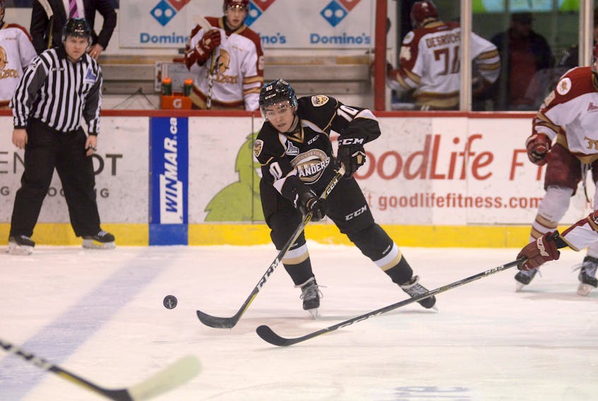 T.J. Shea passes the puck to a teammate during a Charlottetown Islanders power play Friday against the Acadie-Bathurst Titan.