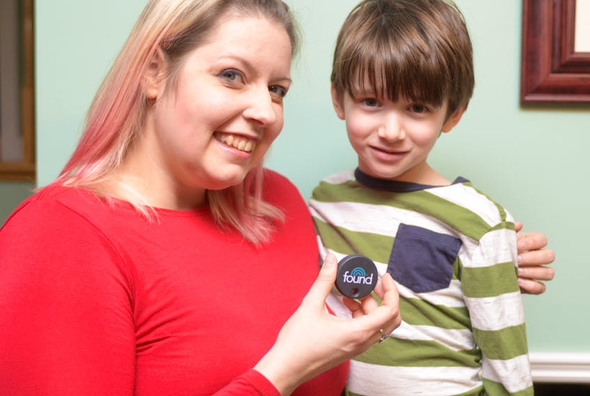 Mariève MacGregor and her five-year-old son, Tristan, show the Found tag, which helps her know her son’s location through a phone app. The two are part of a pilot project by a Charlottetown start-up company Found Network Inc., which hopes to grow the technology in Charlottetown.