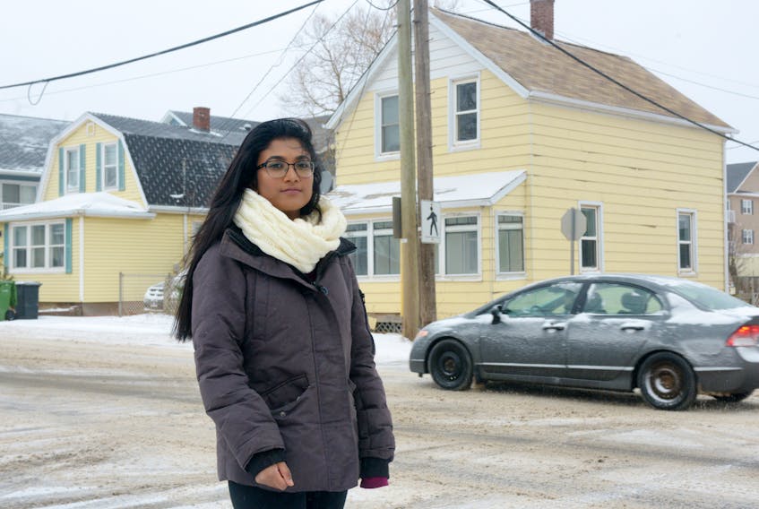 Grade 10 Colonel Gray student Chanuthi Kongahawattege stands at the intersection of Pond and Queen streets in Charlottetown. Chanuthi has started a petition to create safety improvements at the intersection and has received 130 signatures within four days.