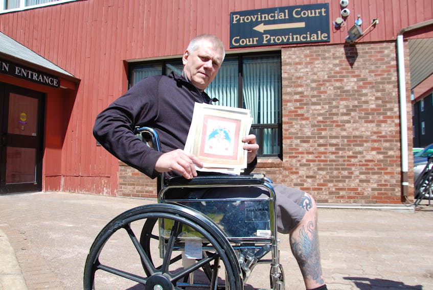 Donald (Artie) Gautreau, owner/operator of Extreme Ink, shows a drawing he did as a thank you to staff at the QEH in Charlottetown. Gautreau received a conditional discharge Wednesday for his part in a violent altercation Dec. 23 that resulted in part of his leg being amputated.