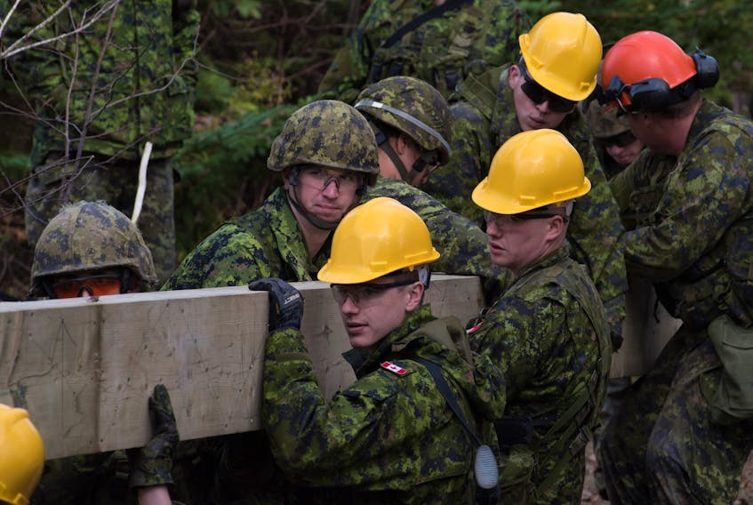 Army Reserve #5 Div soldiers from 36 Combat Engineer Regiment work with troops from 4 Engineer Support Regiment to construct a bridge at the Canadian Coast Guard College in Sydney, N.S. as part of Exercise NIHILO SAPPER. -Photo by MCpl. Charles A. Stephen