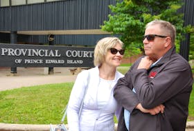 Alex Docherty stands outside the provincial court with his wife Valerie after he and his son were found not guilty in relation to a 2016 fish kill. Farmers that packed the courtroom lined up to congratulate Docherty after the decision was rendered.