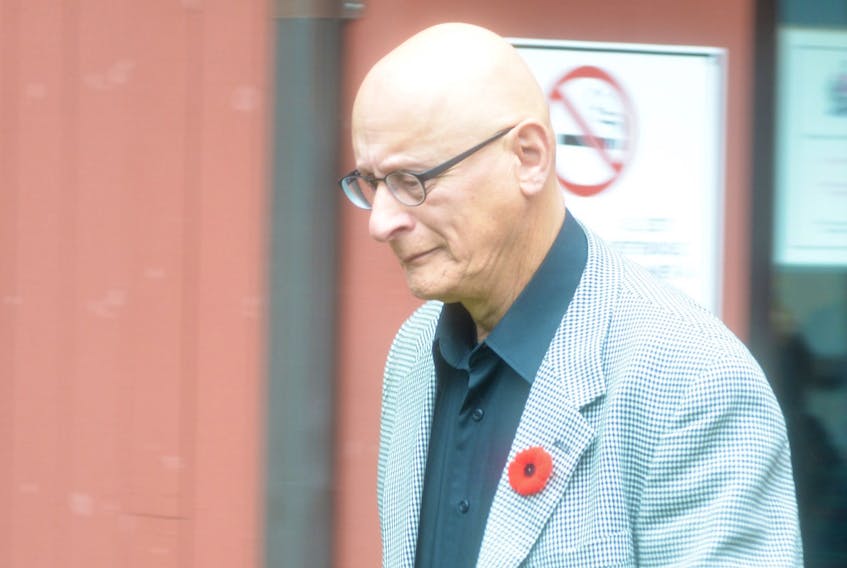 Former high school music teacher Roger Jabbour leaves the provincial courthouse in Charlottetown after being acquitted on sex-related charges dating back more than 25 years.