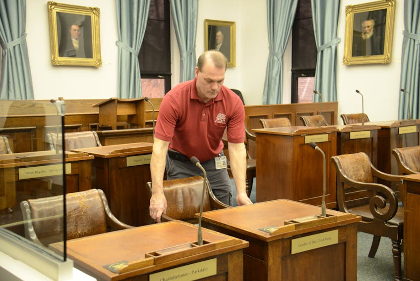Maintenance worker Eelke Wolters gets one of the desks ready in the Coles Building ahead of MLAs returning to the legislative assembly on April 5.