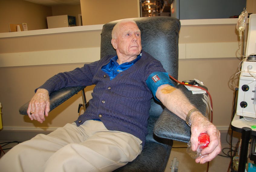 Ewen Stewart, 86, of Stanhope prepares to give his 1,000th blood donation Tuesday at the Charlottetown blood donor centre. Stewart is the first person on P.E.I. to reach this milestone. He donates plasma every week, a blood component that is used to help treat bleeding disorders, liver diseases and many types of cancer.