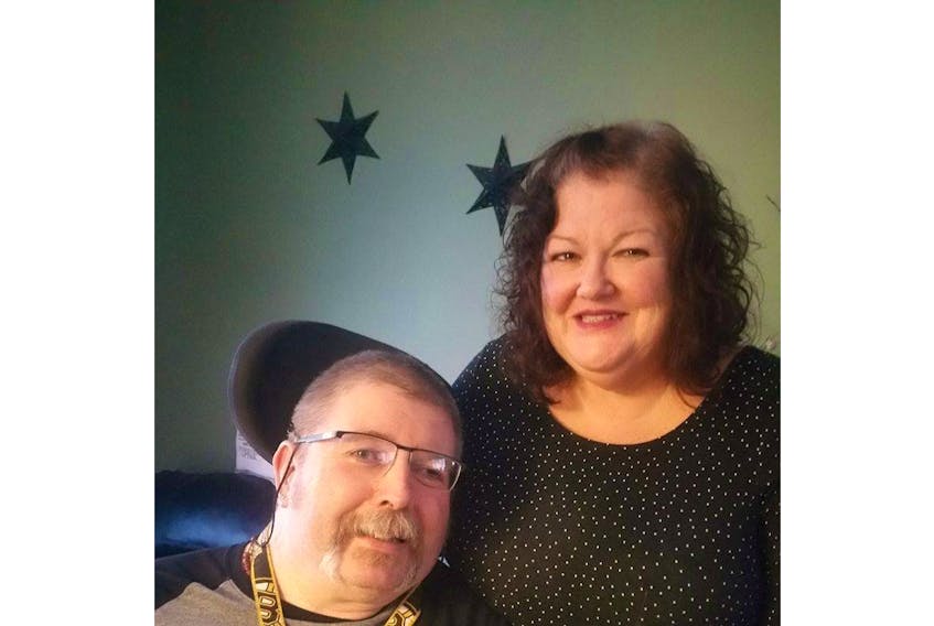 Kathy Campbell-McManus, shown with her husband, Greg, said she thought nothing of stopping to help a man stuck in a recent snowstorm in his scooter because she considered it was simply paying it forward. She said people are always stopping to help her husband, who is in a wheelchair.
