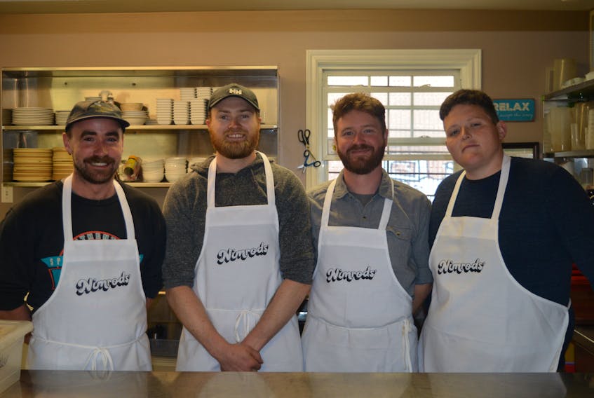 The co-owners of Nimrods’, from left, Don Weir, Nigel Haan, Jesse Clausheide and Mikey Wasnidge, have donned their aprons and are rolling up their sleeves to help out at the Upper Room Hospitality Ministry Soup Kitchen in Charlottetown. For every pizza they sell at their floating pizza bar on the waterfront they will provide a hot meal for those in need at the soup kitchen.